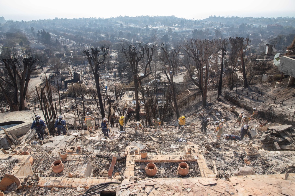 Search and Rescue teams perform search mission in Pacific Palisades