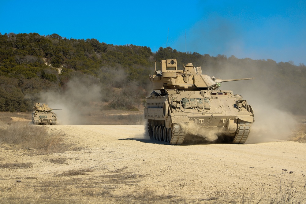 M2A3 Bradley Fighting Vehicles maneuver during 3ABCT/1CD CALFEX