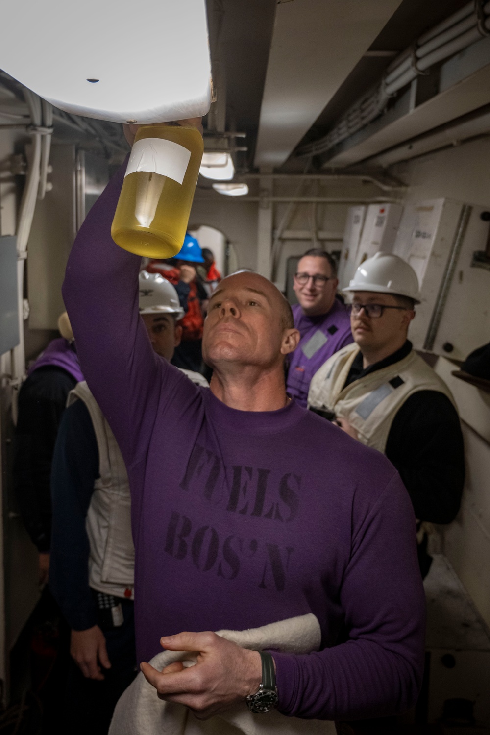 Nimitz Chief Warrant Officer Inspects Fuel Sample