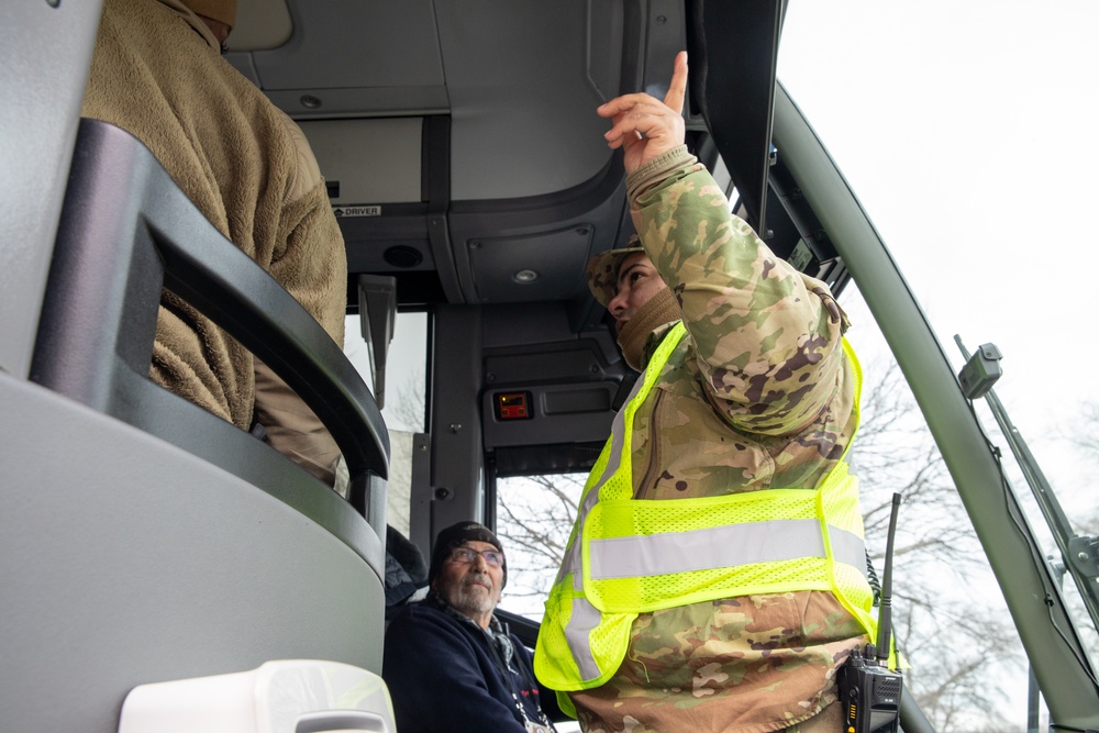 U.S. Army Staff Sgt. Anthony Cintron, assigned to Joint Task Force - District of Columbia, Directs Bus Driver at D.C. Armory