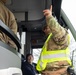 U.S. Army Staff Sgt. Anthony Cintron, assigned to Joint Task Force - District of Columbia, Directs Bus Driver at D.C. Armory