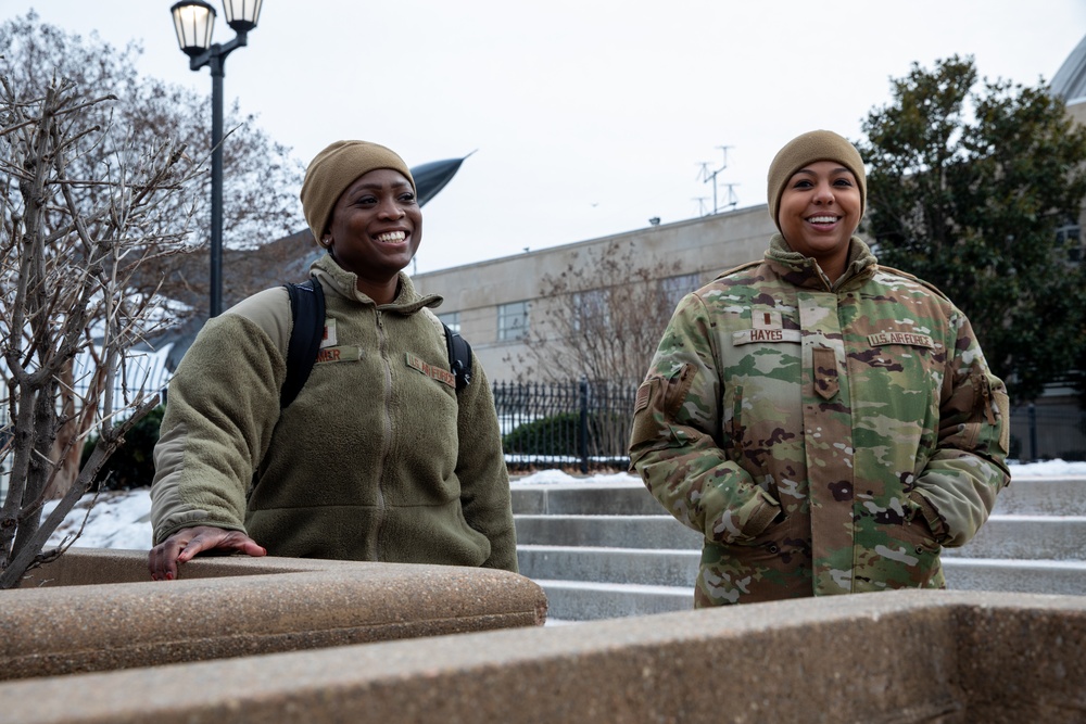 U.S. Air Force Capt. Morgan Comer, left, and 2nd Lt. Desiree Hayes Prepare to Out-Process at the D.C. Armory After Supporting the 60th Presidential Inauguration