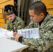 Sailors from NAVSUP headquarters serve as judges for the NJROTC program in the Mid-Atlantic Competition.