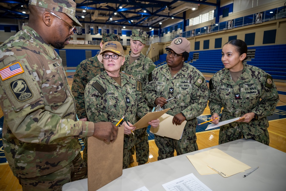 Sailors from NAVSUP headquarters serve as judges for the NJROTC program in the Mid-Atlantic Competition.