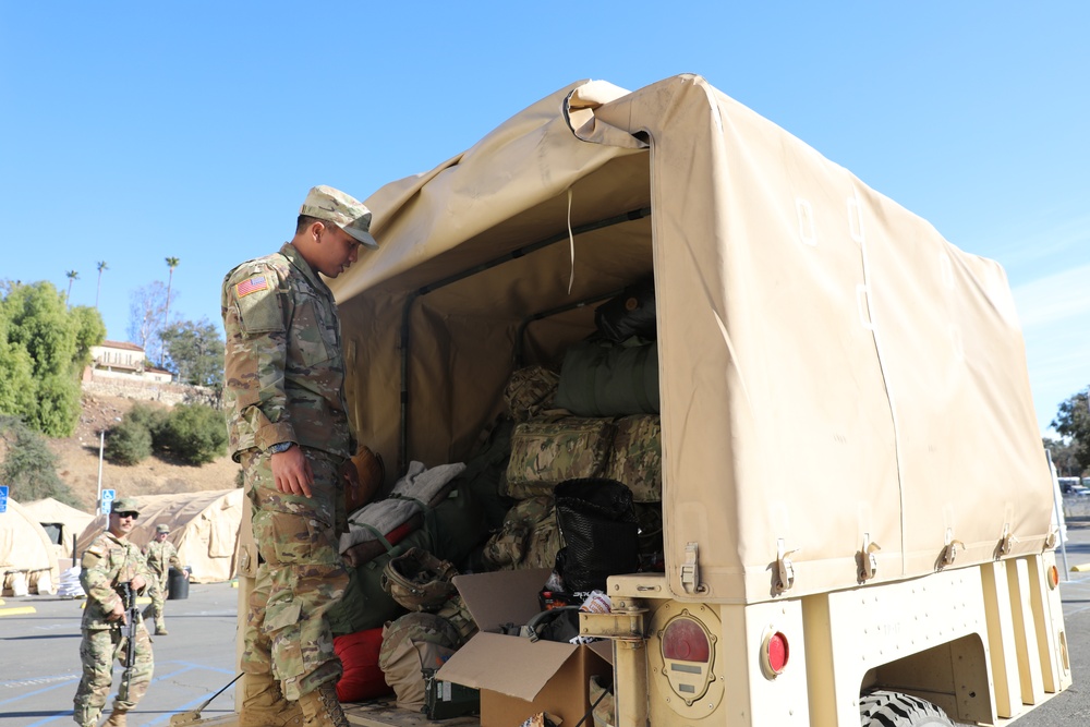 1st Battalion, 143rd Field Artillery Regiment prepares to leave the Rose Bowl Stadium