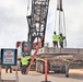 Construction Workers Prepare for a Crane Load Test