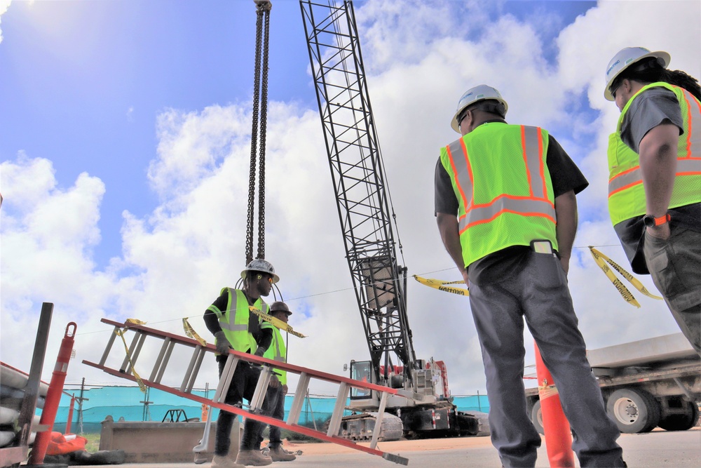 Safety Staff From the Office In Charge Of Construction Monitor Preparations for a Crane Load Test