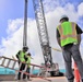 Safety Staff From the Office In Charge Of Construction Monitor Preparations for a Crane Load Test