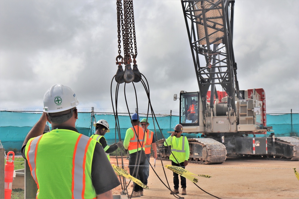 A Safety Specialist with OICC MCM Advises Construction Workers as they Prepare for a Crane Load Test