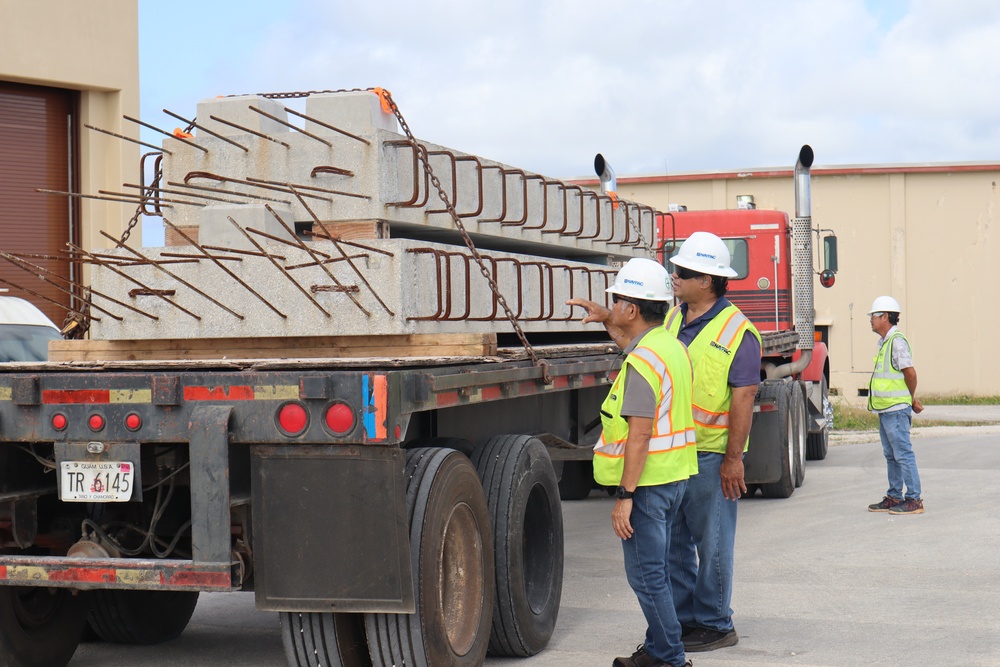 OICC Staff Inspect a Ten-Ton Precast Concrete Slab For Defects