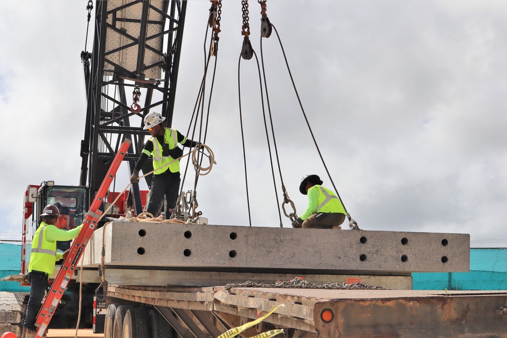 Crew Members Prep Guide Ropes and Grapples During a Concrete Load Test