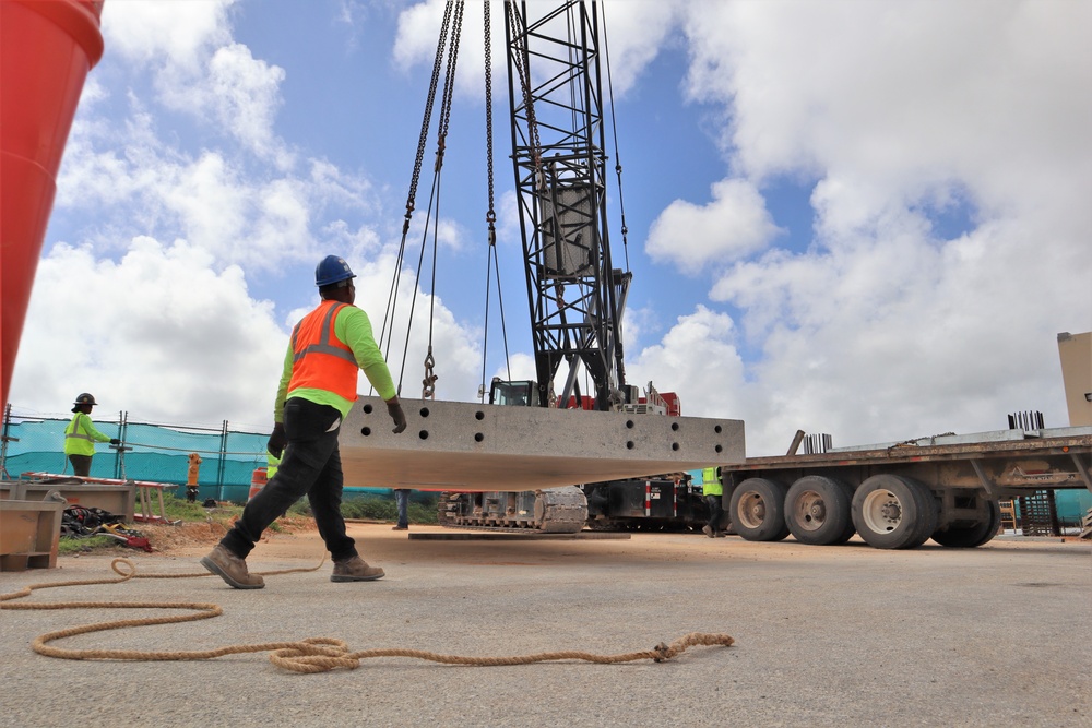 A Spotter Moves Out of the Way of a Ten-Ton Precast Concrete Slab During a Crane Load Test