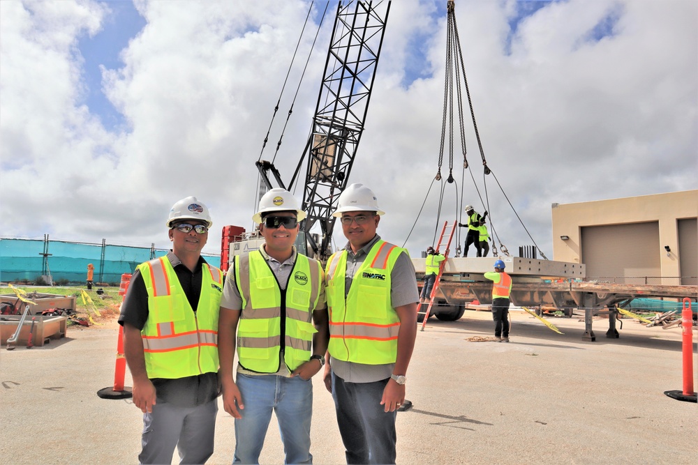 A Contractor Poses with OICC MCM Safety Specialists After a Successful Crane Load Test