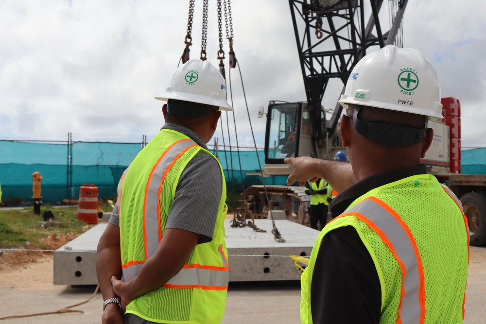 Safety Specialists with the Office in Charge of Construction Monitor for Safety Concerns During a Crane Load Test