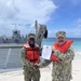 Det Diego Garcia congratulations BU2 Johnson on your reenlistment