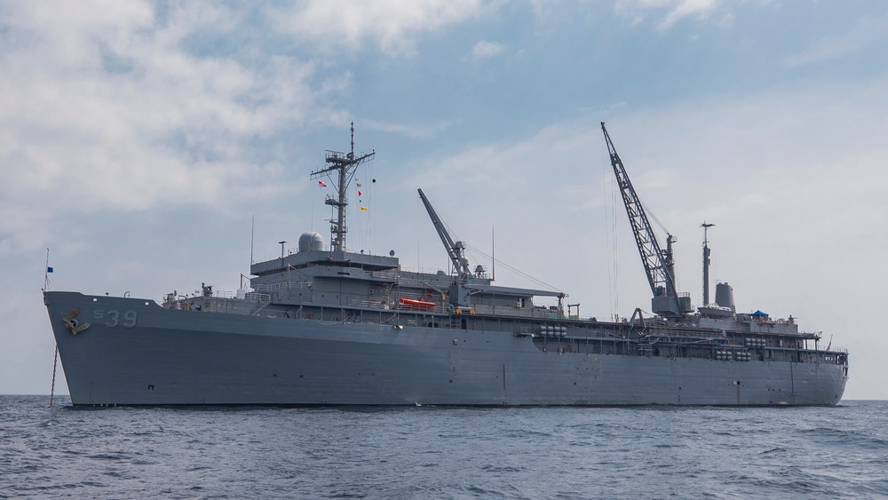 Emory S. Land conducts (AS 39) boat operations while anchored in the Andaman Sea