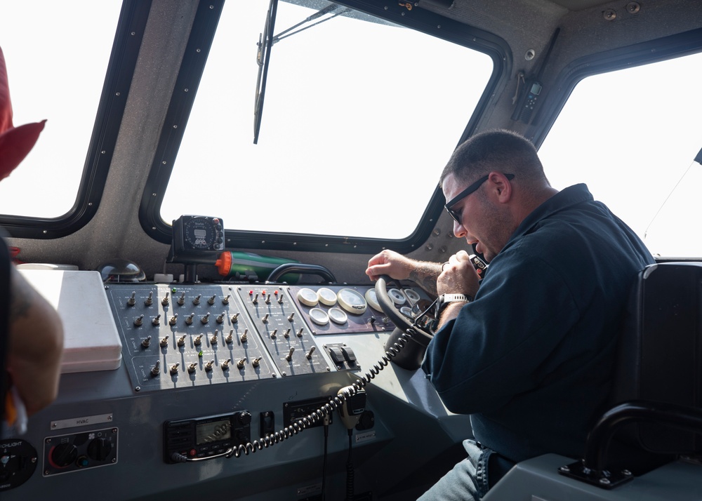 Emory S. Land conducts (AS 39) boat operations while anchored in the Andaman Sea