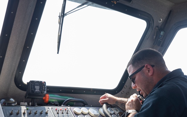 Emory S. Land conducts (AS 39) boat operations while anchored in the Andaman Sea