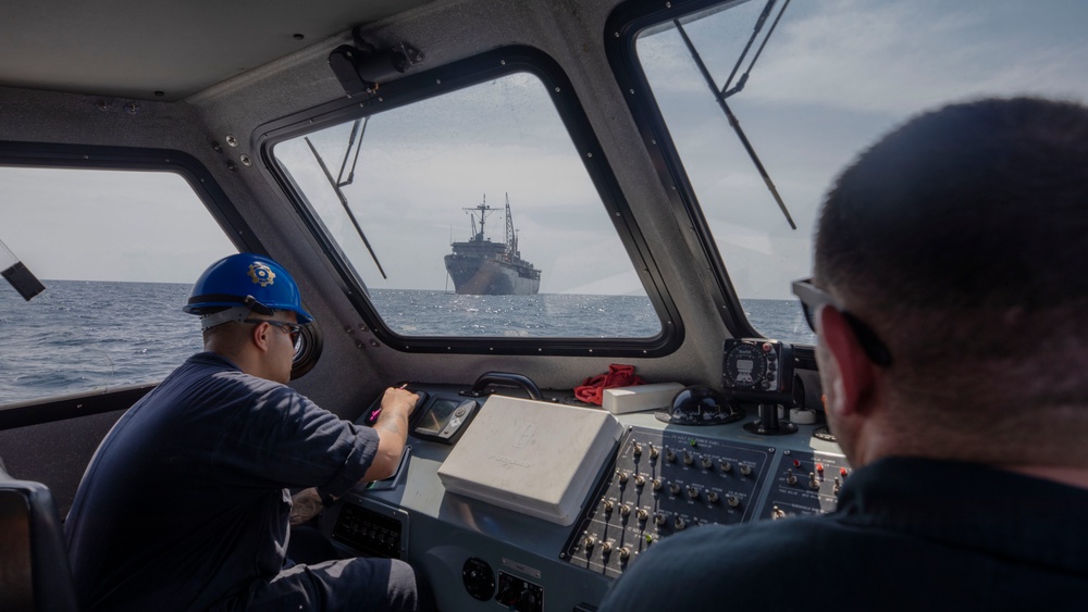 Emory S. Land conducts (AS 39) boat operations while anchored in the Andaman Sea