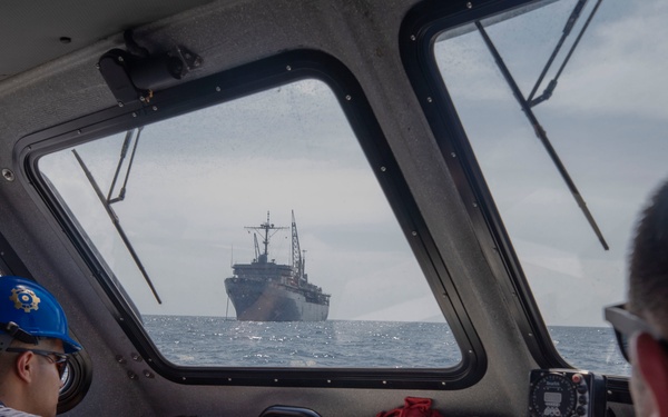 Emory S. Land conducts (AS 39) boat operations while anchored in the Andaman Sea