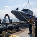 Emory S. Land conducts (AS 39) boat operations while anchored in the Andaman Sea