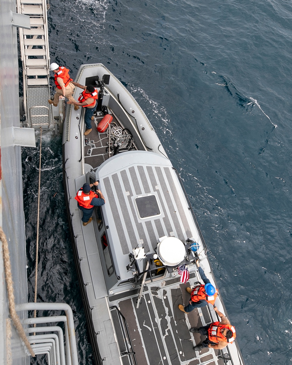 Emory S. Land conducts boat operations while anchored in Andaman Sea