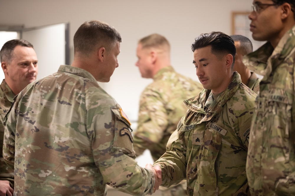 Lt. Gen. Joseph A. Ryan awards coins to 10th Mountain Soldiers during Combined Resolve 25-1