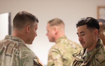 Lt. Gen. Joseph A. Ryan awards coins to 10th Mountain Soldiers during Combined Resolve 25-1