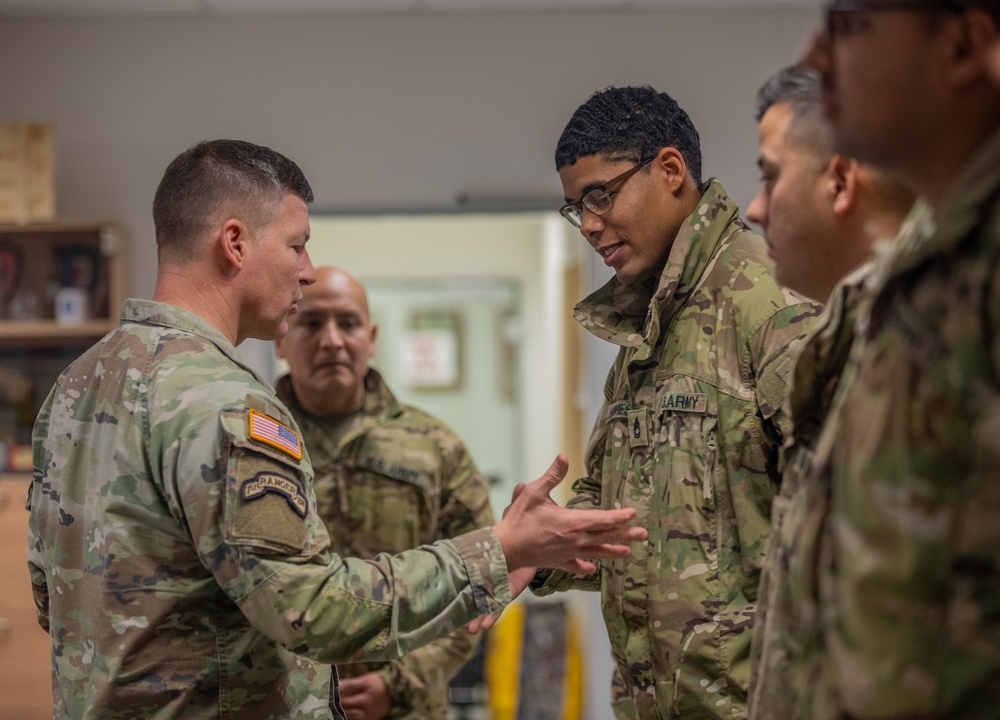 Lt. Gen. Joseph A. Ryan awards coins to 10th Mountain Soldiers during Combined Resolve 25-1