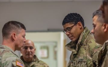 Lt. Gen. Joseph A. Ryan awards coins to 10th Mountain Soldiers during Combined Resolve 25-1