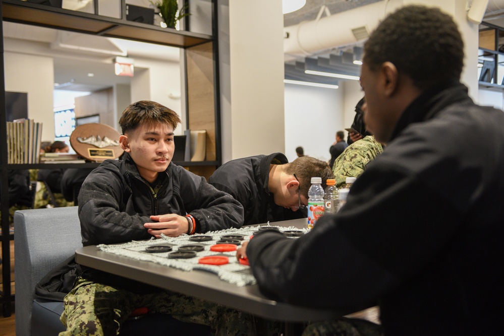Accession-Level Sailors Play Games at the USO