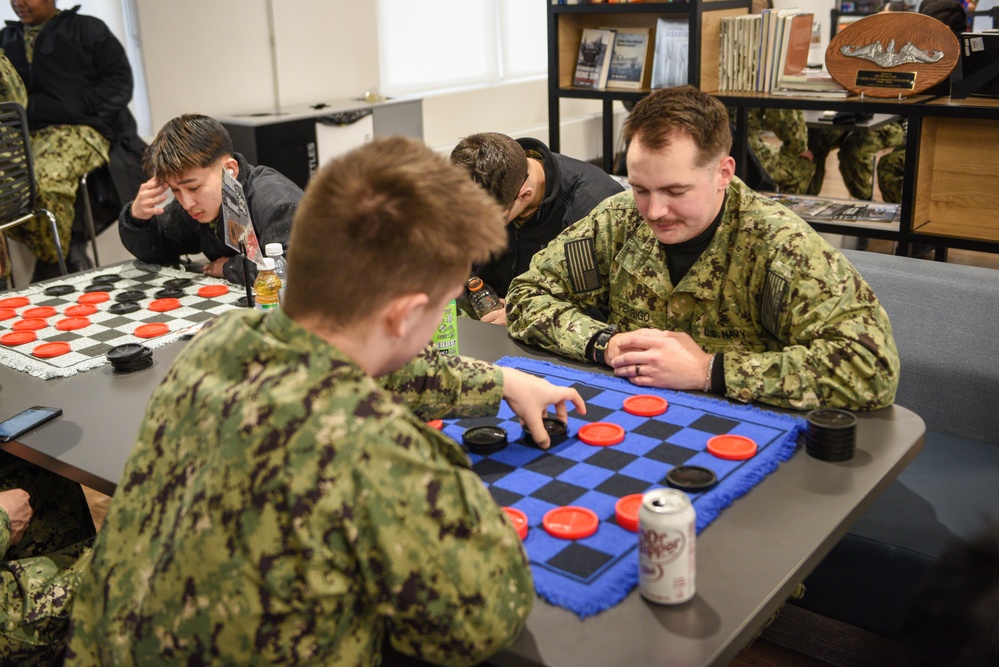 Accession-Level Sailors Play Games at the USO