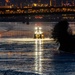 Sunfire and Ice: Towboats navigate through frozen rivers during Pittsburgh sunrise