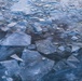 Sunfire and Ice: Towboats navigate through frozen rivers during Pittsburgh sunrise