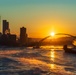 Sunfire and Ice: Towboats navigate through frozen rivers during Pittsburgh sunrise