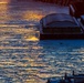 Sunfire and Ice: Towboats navigate through frozen rivers during Pittsburgh sunrise