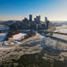 Sunfire and Ice: Towboats navigate through frozen rivers during Pittsburgh sunrise