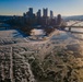 Sunfire and Ice: Towboats navigate through frozen rivers during Pittsburgh sunrise