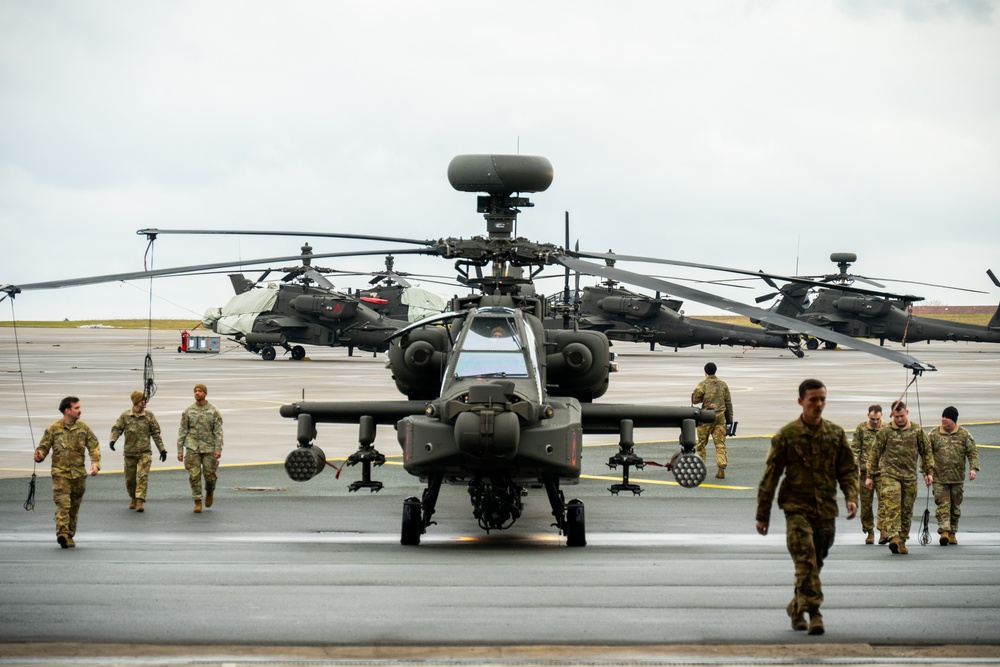 12th CAB Soldiers ground guide an Apache Guardian during the second Polish Apache Initiative summit