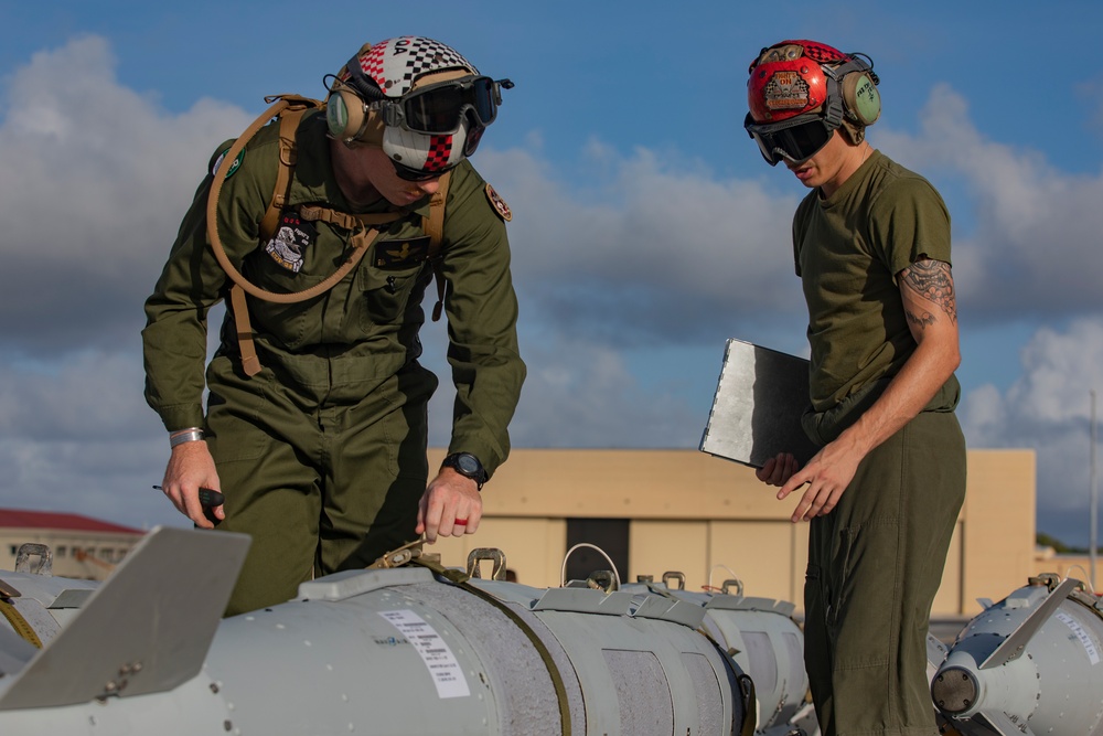 U.S. Marines transport and ready ordnance at Andersen Air Force Base