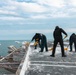 USS Gerald R. Ford (CVN 78) Sailors shovel snow off flight deck