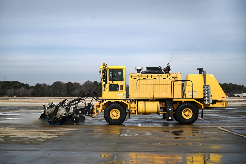 Airmen remove snow, ice for T-38 Talon, F-22 Raptor ops