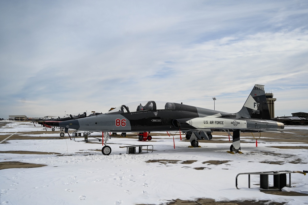 Airmen remove snow, ice for T-38 Talon, F-22 Raptor ops