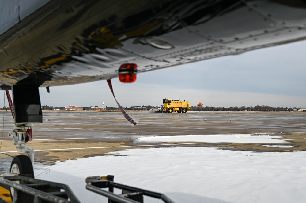 Airmen remove snow, ice for T-38 Talon, F-22 Raptor ops
