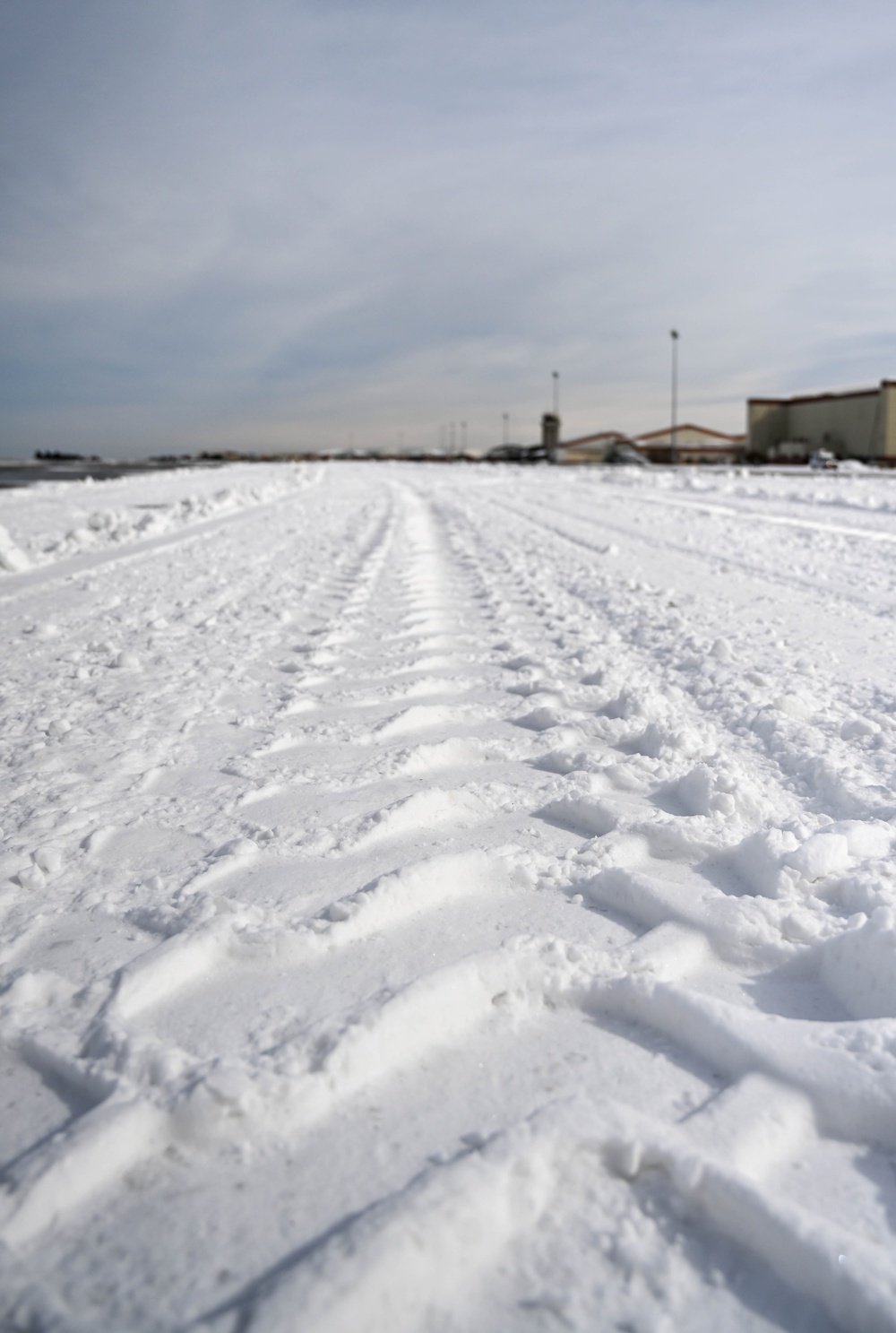 Airmen remove snow, ice for T-38 Talon, F-22 Raptor ops