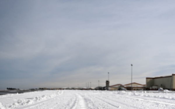 Airmen remove snow, ice for T-38 Talon, F-22 Raptor ops