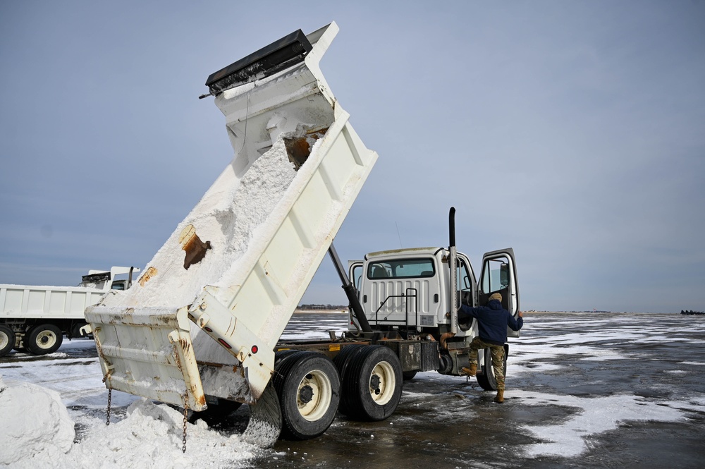 Airmen remove snow, ice for T-38 Talon, F-22 Raptor ops
