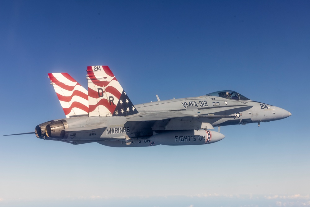 Marine F/A-18s fly over the Pacific