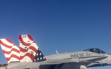 Marine F/A-18s fly over the Pacific