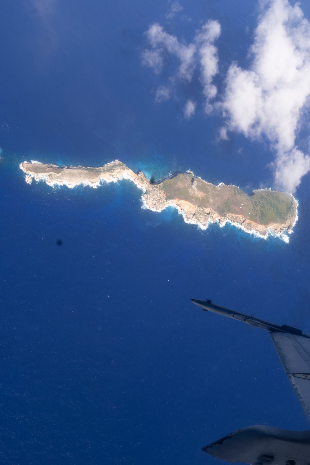 Marine F/A-18s fly over the Pacific